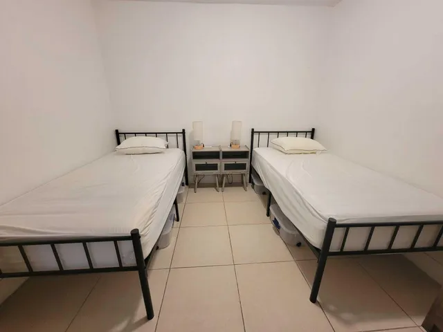 a bedroom with a bed and a table in it