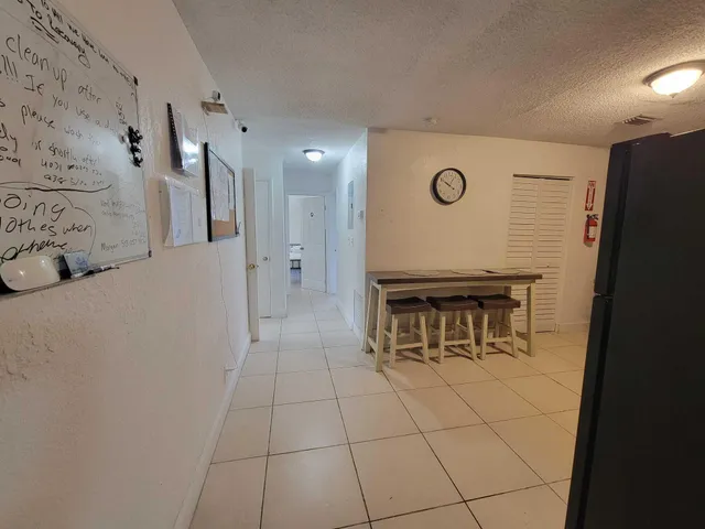 a view of a hallway with seating area