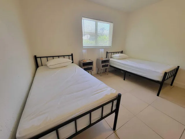 a bedroom with a bed and a table in it