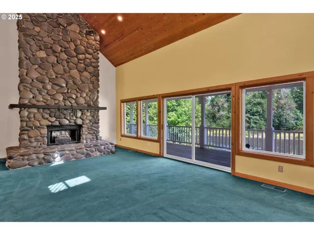 a view of an empty room with a fireplace