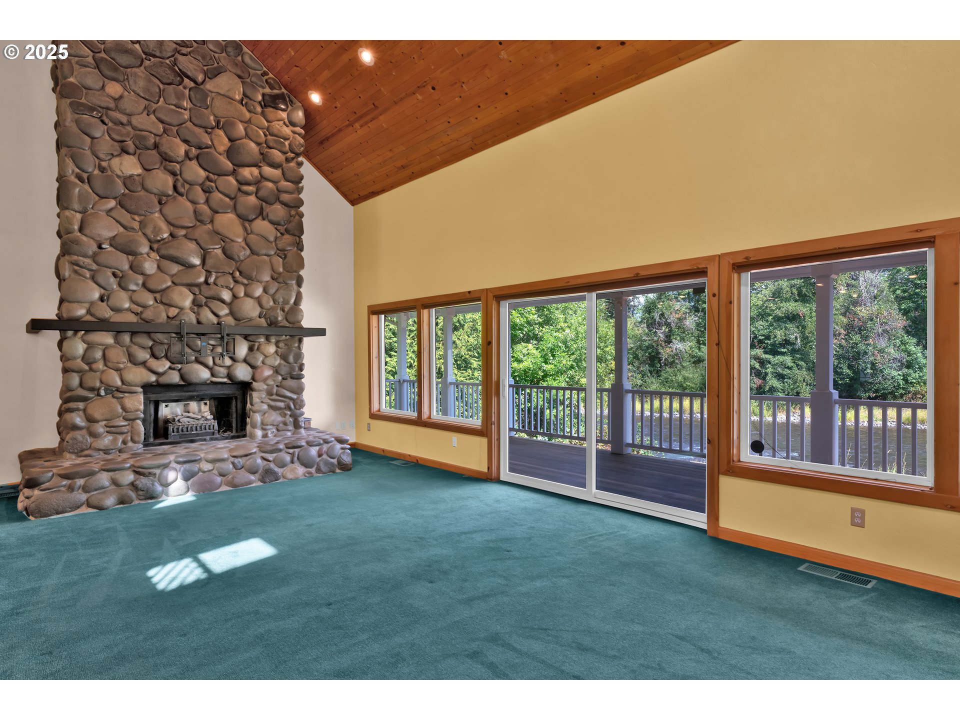 78341 Snauer Lane Cottage Grove, OR 97424 - Photo 15 of 48 a view of an empty room with a fireplace