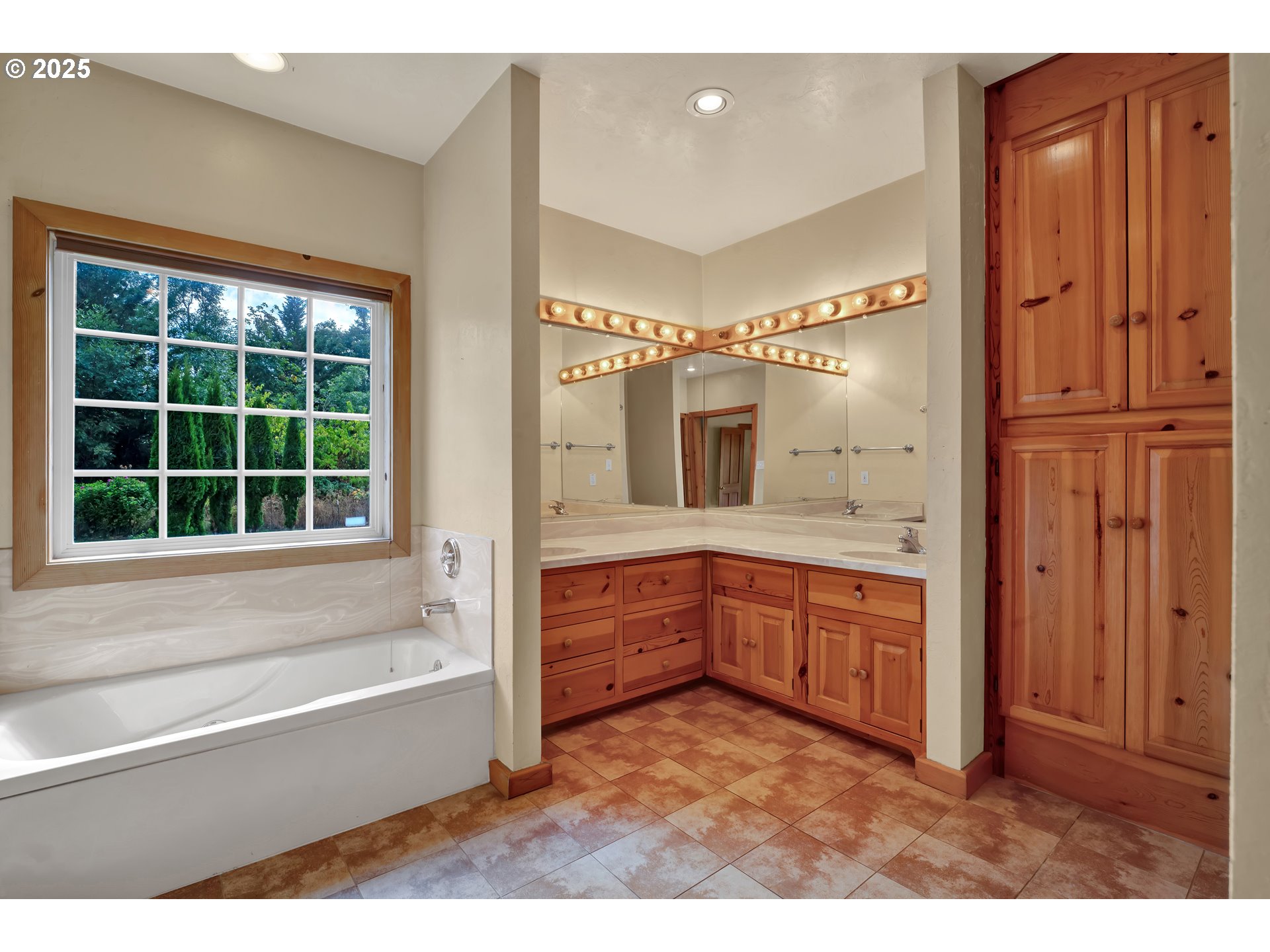 78341 Snauer Lane Cottage Grove, OR 97424 - Photo 21 of 48 a bathroom with a tub sink and mirror