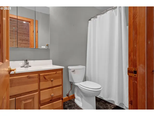 a view of a lake with beach and outdoor space