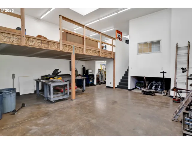 a room with lots of books and a wooden floors