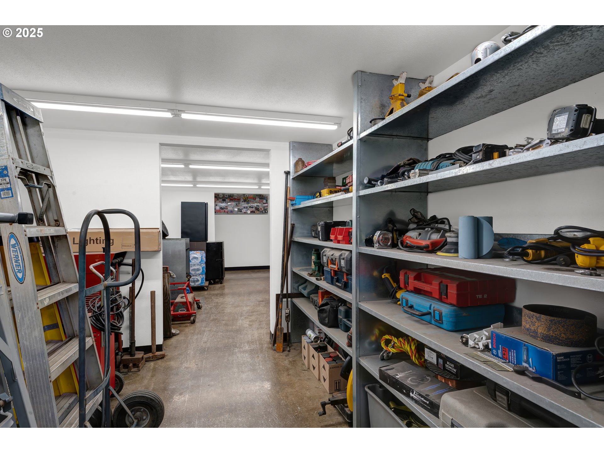 78341 Snauer Lane Cottage Grove, OR 97424 - Photo 36 of 48 a room with lots of books and a wooden floors
