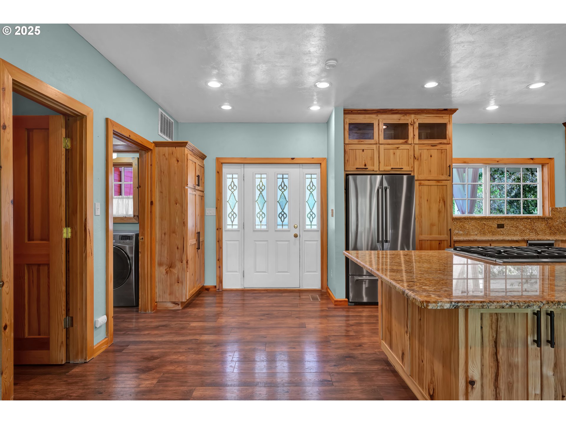78341 Snauer Lane Cottage Grove, OR 97424 - Photo 5 of 48 a open kitchen with stainless steel appliances granite countertop a refrigerator and wooden floor