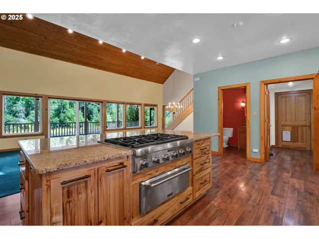 a kitchen that has a sink and a stove