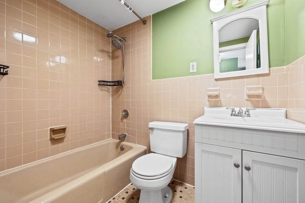 116 Sycamore Street, Unit 22 Somerville, MA 02145 - Photo 12 of 18 a bathroom with a sink toilet and shower