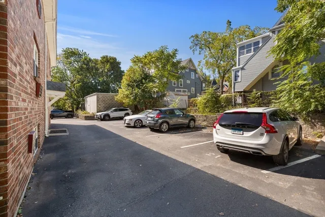 a front view of a house with parking space