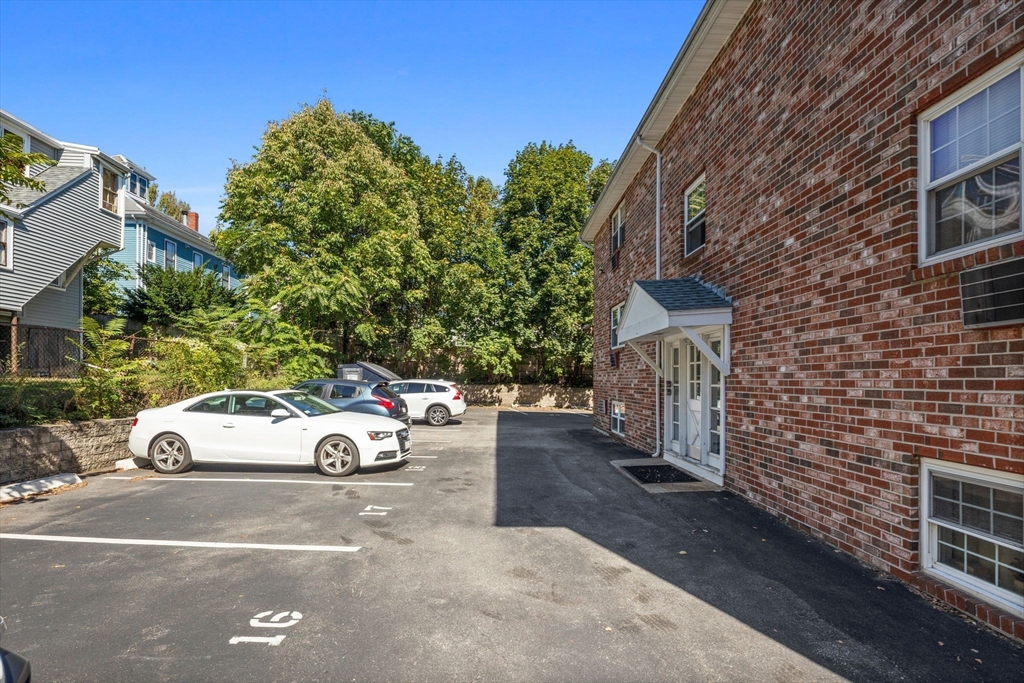 116 Sycamore Street, Unit 22 Somerville, MA 02145 - Photo 18 of 18 a view of a car parked in front of a house