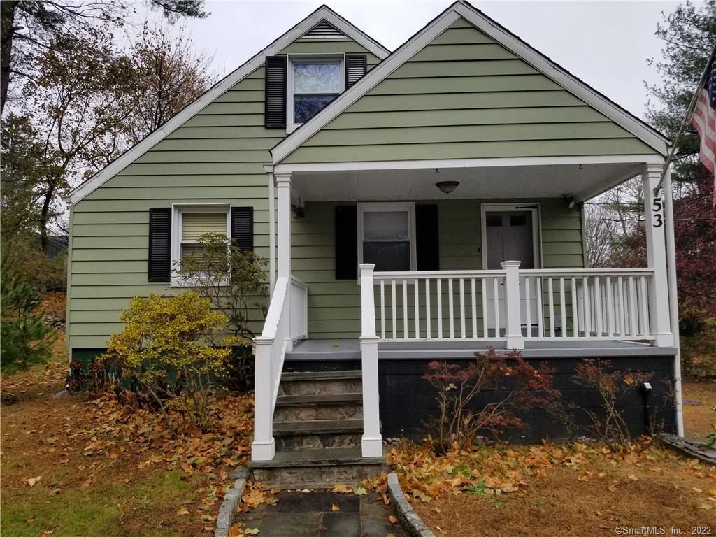 53 Wilridge Road Ridgefield, CT 06877 - Photo 1 of 1 a view of a house with wooden deck and a yard