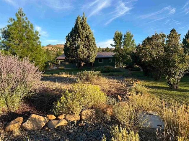 a view of a lake with a house in the background