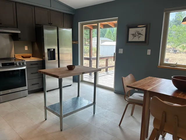a view of a dining room with furniture window and outside view