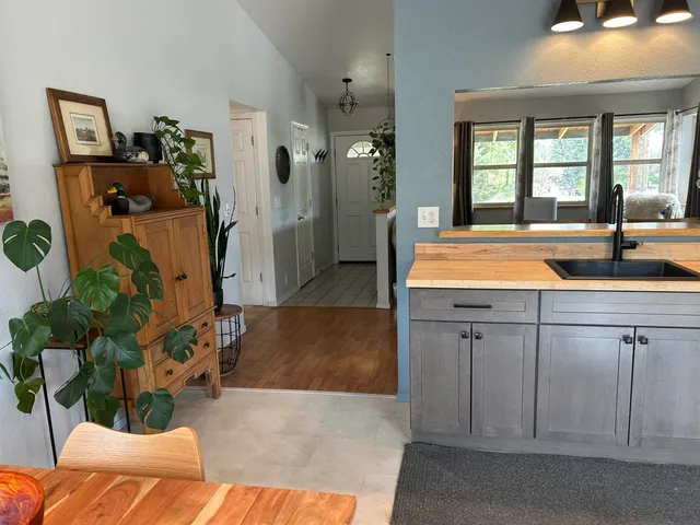 a spacious bathroom with a granite countertop sink and a mirror