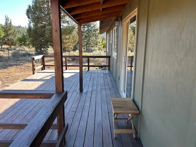 a view of a wooden floor with a yard