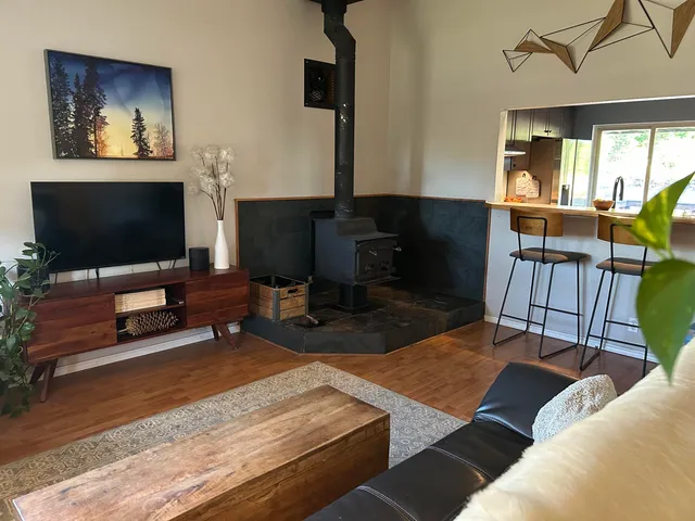 a bedroom with furniture and a flat screen tv