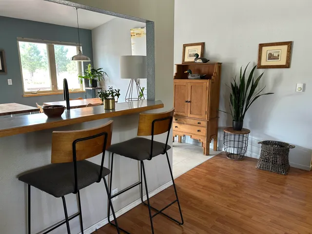 a dining room with furniture and window