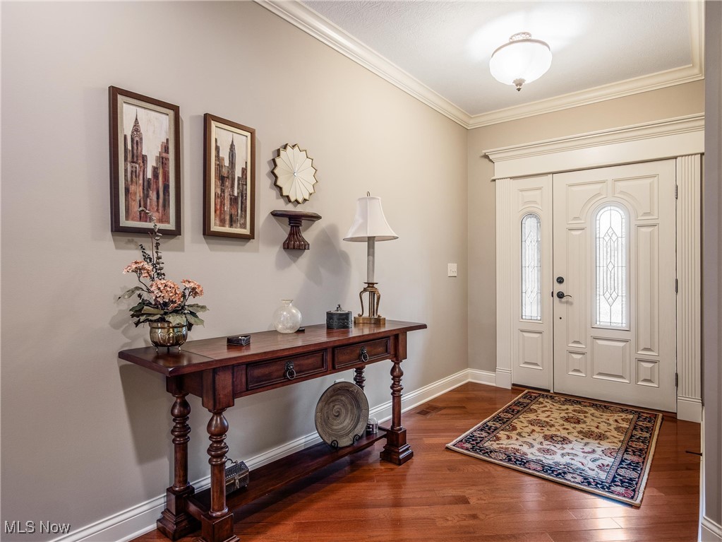 5349 Slater Ridge Westerville, OH 43082 - Photo 2 of 50 Entrance foyer featuring ornamental molding and dark wood-style flooring