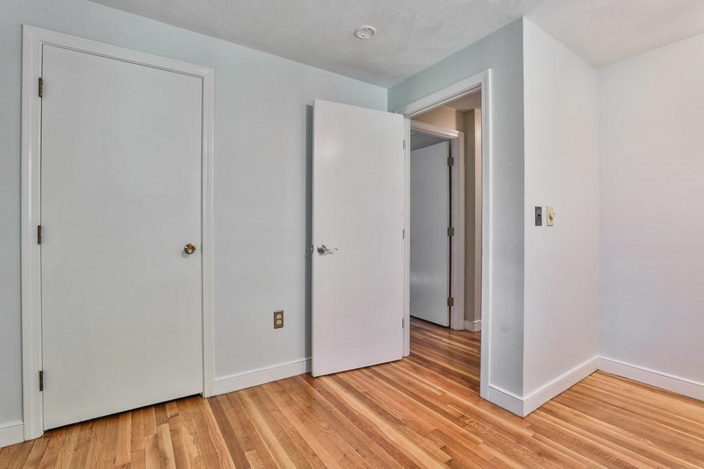 22 Withington Lane Harvard, MA 01451 - Photo 14 of 26 a view of an empty room with wooden floor