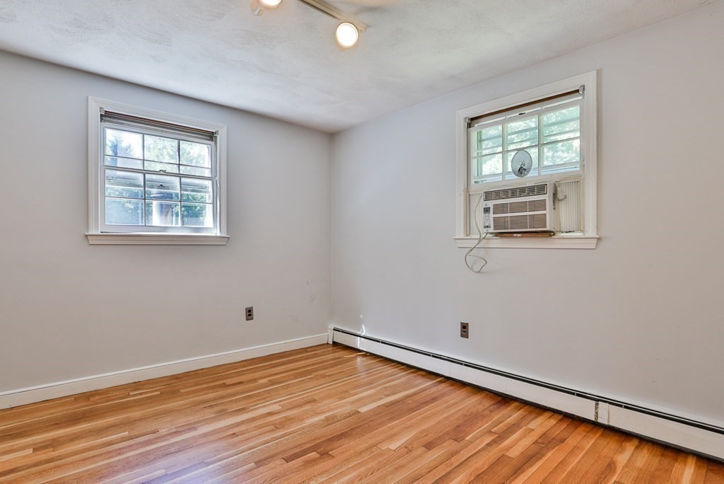 22 Withington Lane Harvard, MA 01451 - Photo 16 of 26 a view of empty room with wooden floor and fan