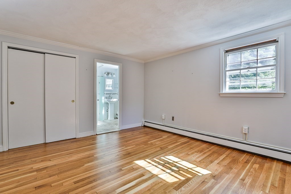 22 Withington Lane Harvard, MA 01451 - Photo 19 of 26 a view of an empty room with wooden floor and a window