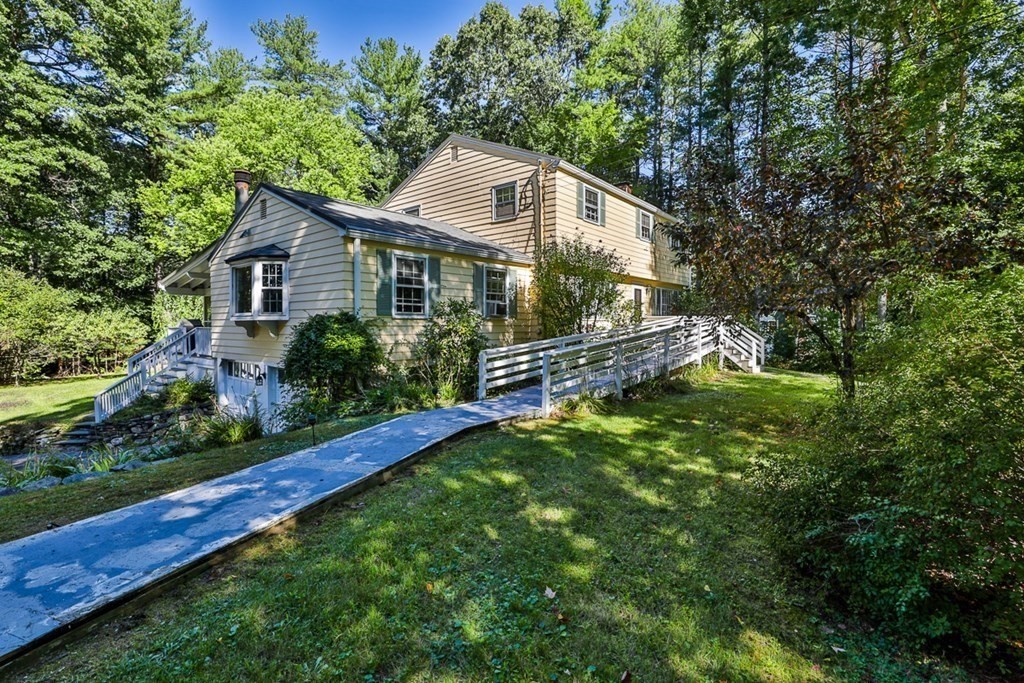 22 Withington Lane Harvard, MA 01451 - Photo 2 of 26 a front view of house with yard and green space