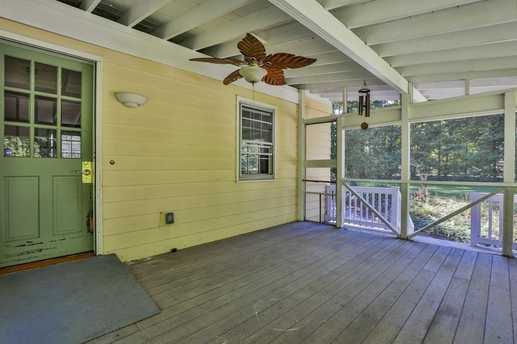 22 Withington Lane Harvard, MA 01451 - Photo 22 of 26 a view of a porch with wooden floor and front door