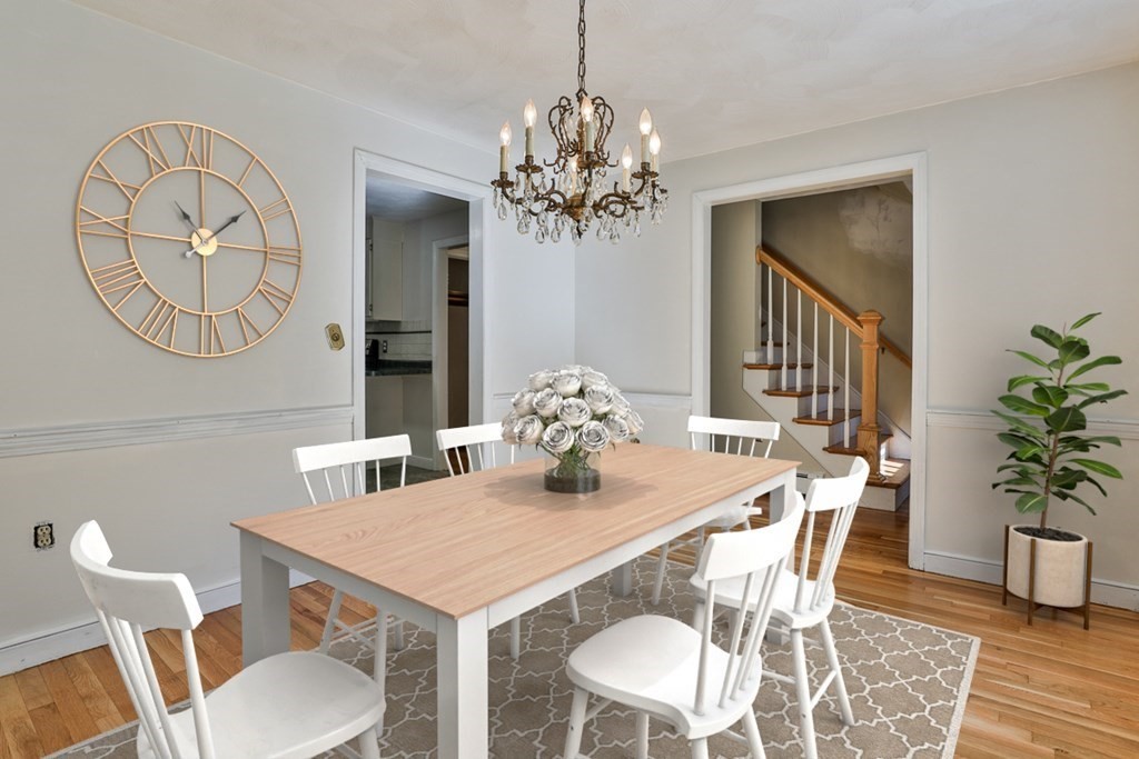 22 Withington Lane Harvard, MA 01451 - Photo 5 of 26 a view of a dining room with furniture and chandelier