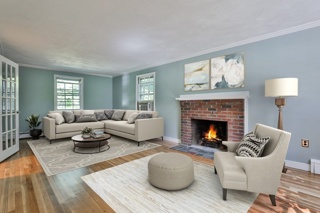 22 Withington Lane Harvard, MA 01451 - Photo 6 of 26 a living room with furniture and a fireplace