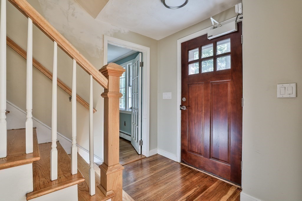 22 Withington Lane Harvard, MA 01451 - Photo 7 of 26 a view of an entryway with wooden floor and door