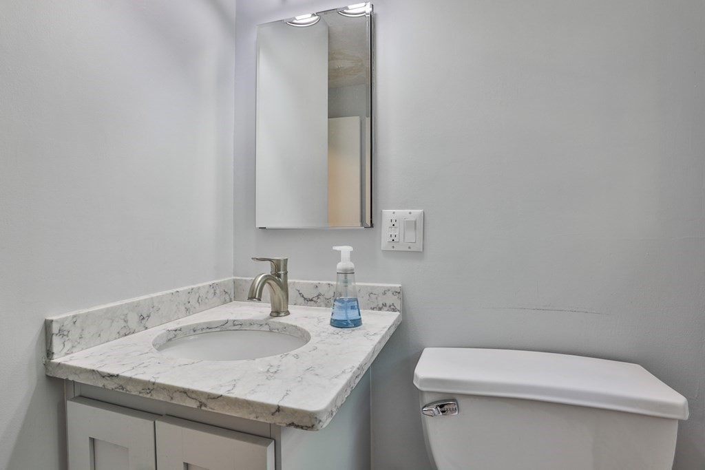 22 Withington Lane Harvard, MA 01451 - Photo 8 of 26 a bathroom with a sink and a toilet