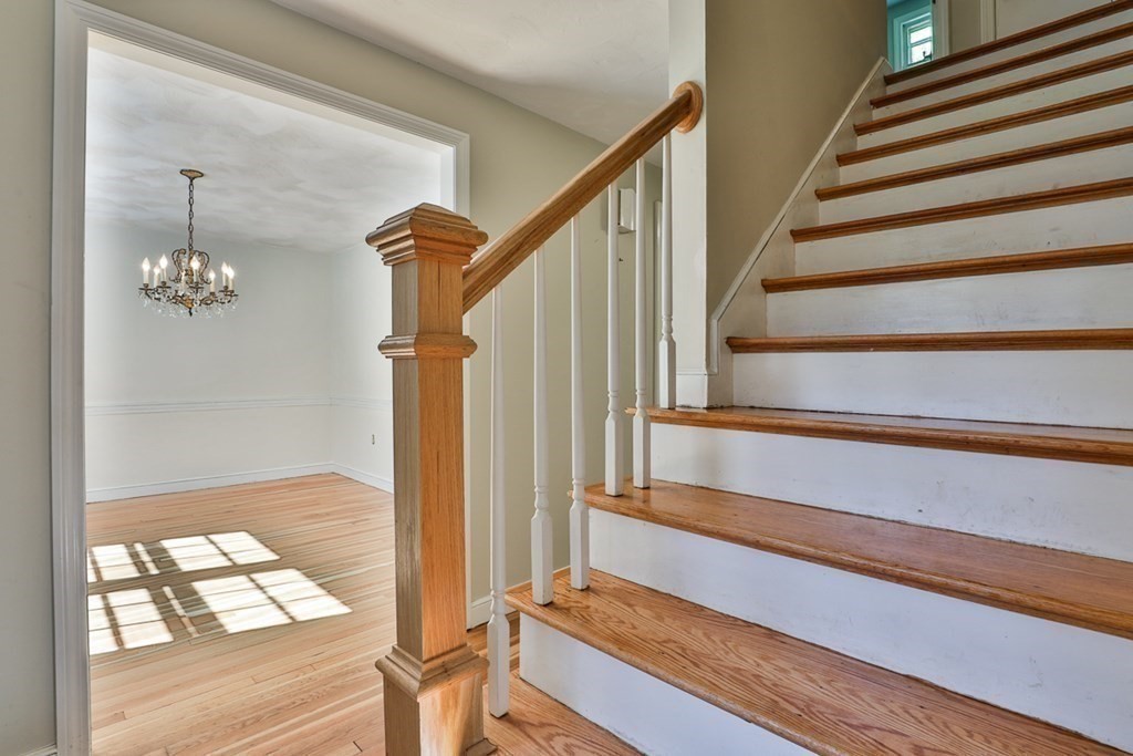 22 Withington Lane Harvard, MA 01451 - Photo 9 of 26 a view of staircase with wooden floor and fan