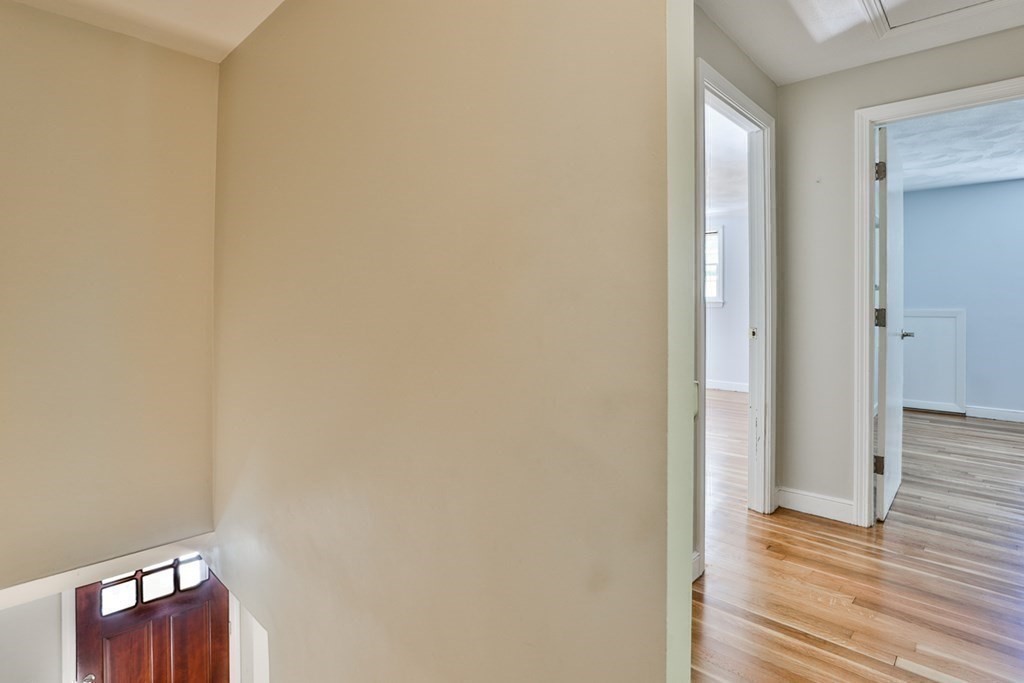 22 Withington Lane Harvard, MA 01451 - Photo 10 of 26 a view of hallway with wooden floor