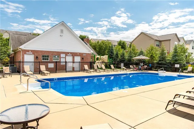 a view of outdoor kitchen and dining area