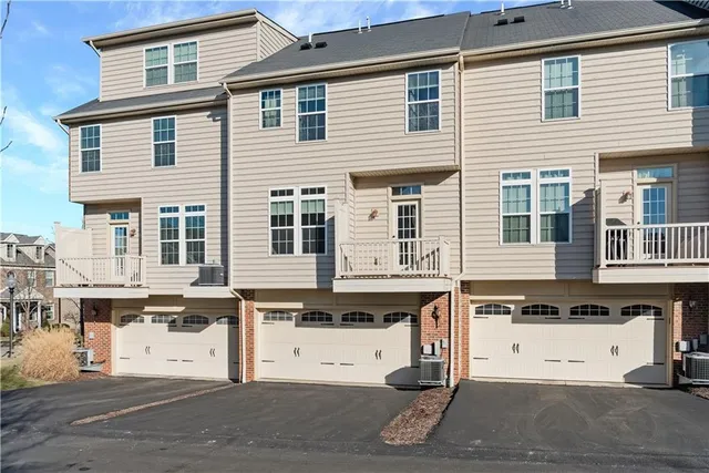 a view of a white building among the street