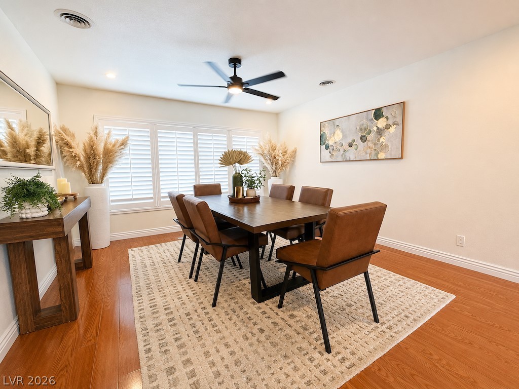 3010 East Viking Road Las Vegas, NV 89121 - Photo 24 of 48 Hardwood floors and bright windows create a warm and inviting dining area.
