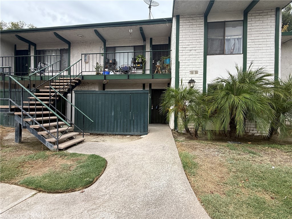 1735 East Washington Street, Unit G13 Colton, CA 92324 - Photo 1 of 1 a view of a house with backyard and sitting area