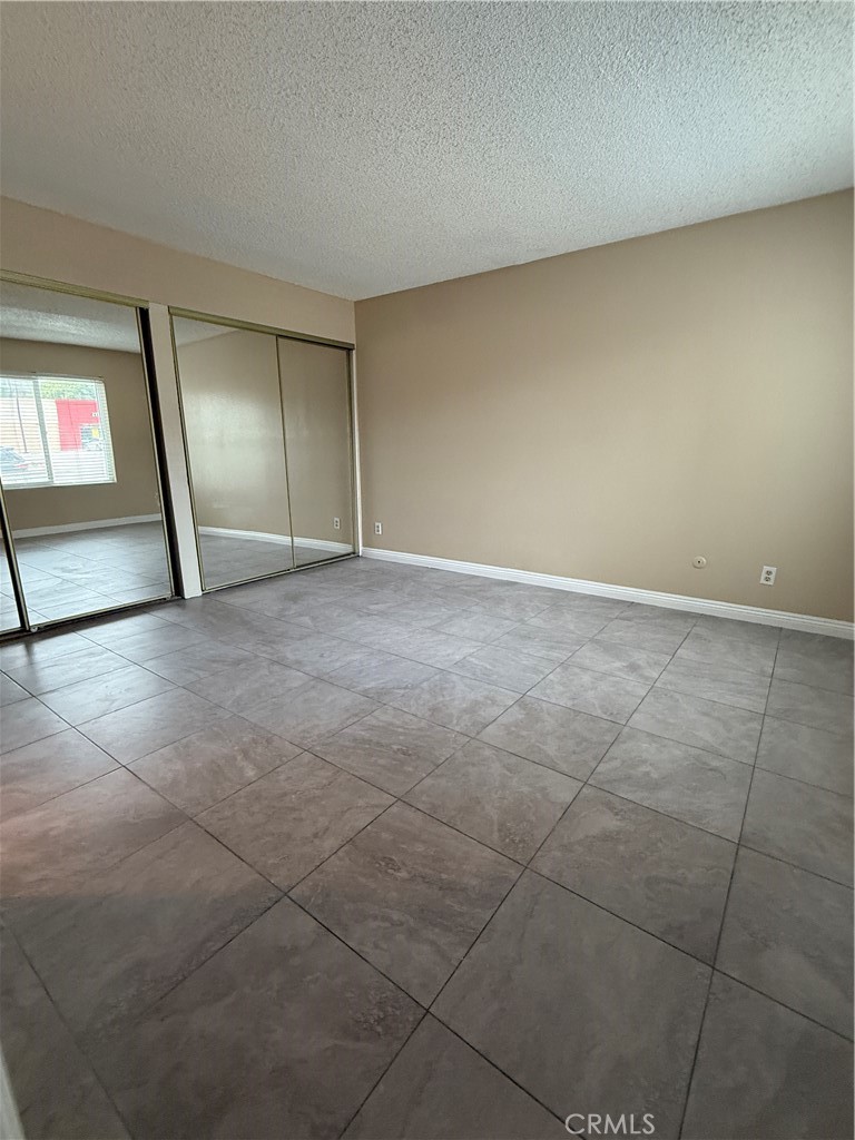1735 East Washington Street, Unit G13 Colton, CA 92324 - Photo 11 of 19 a view of an empty room with a window