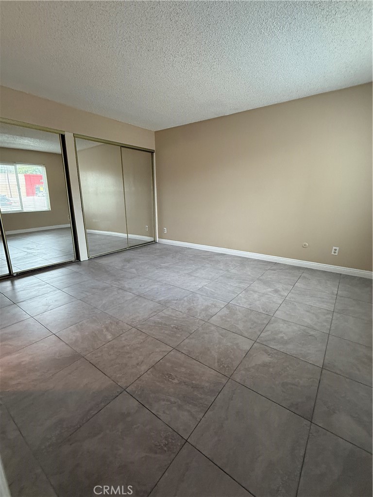 1735 East Washington Street, Unit G13 Colton, CA 92324 - Photo 13 of 19 a view of an empty room with a window