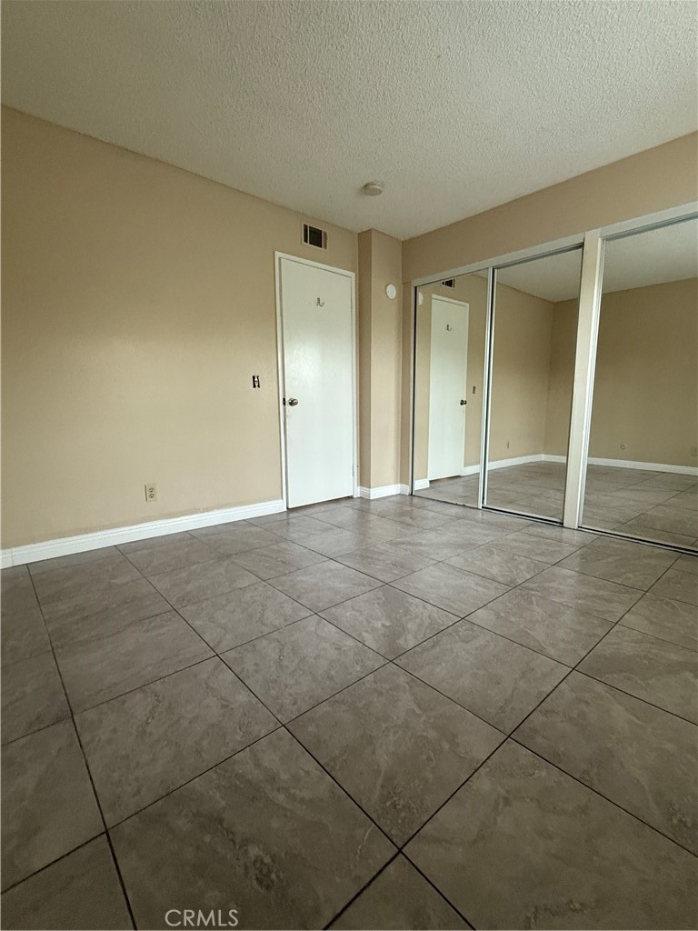 1735 East Washington Street, Unit G13 Colton, CA 92324 - Photo 16 of 19 a view of an empty room and window