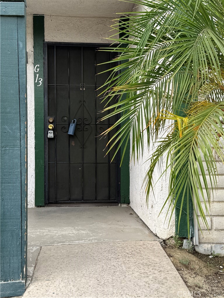 1735 East Washington Street, Unit G13 Colton, CA 92324 - Photo 19 of 19 a view of a wooden door