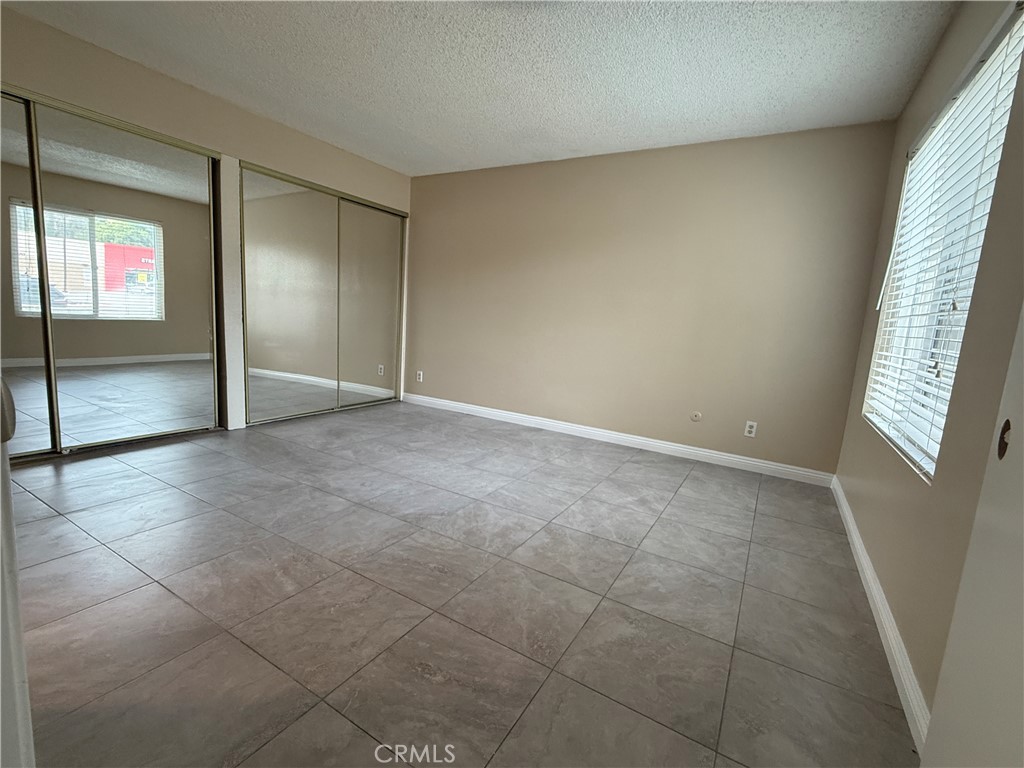 1735 East Washington Street, Unit G13 Colton, CA 92324 - Photo 10 of 19 a view of an empty room and window