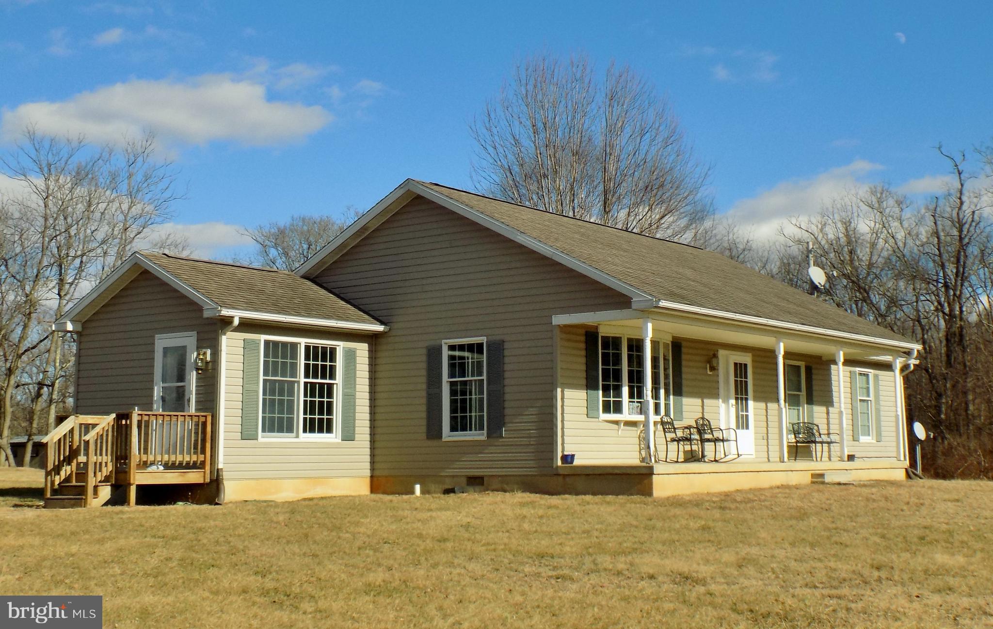 150 Longmarsh Road Berryville, VA 22611 - Photo 1 of 22 a front view of a house with a patio