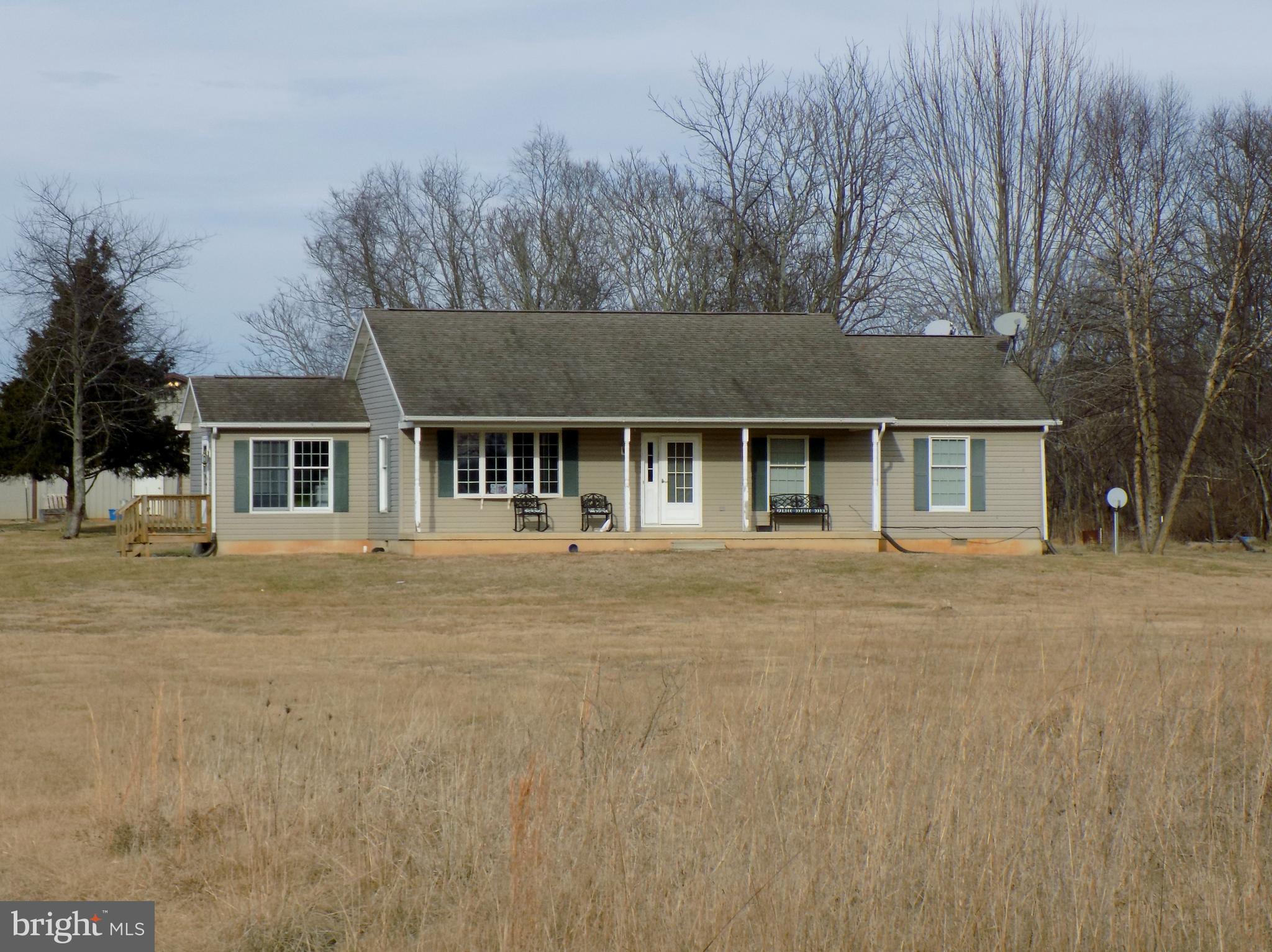 150 Longmarsh Road Berryville, VA 22611 - Photo 2 of 22 a front view of a house with a garden