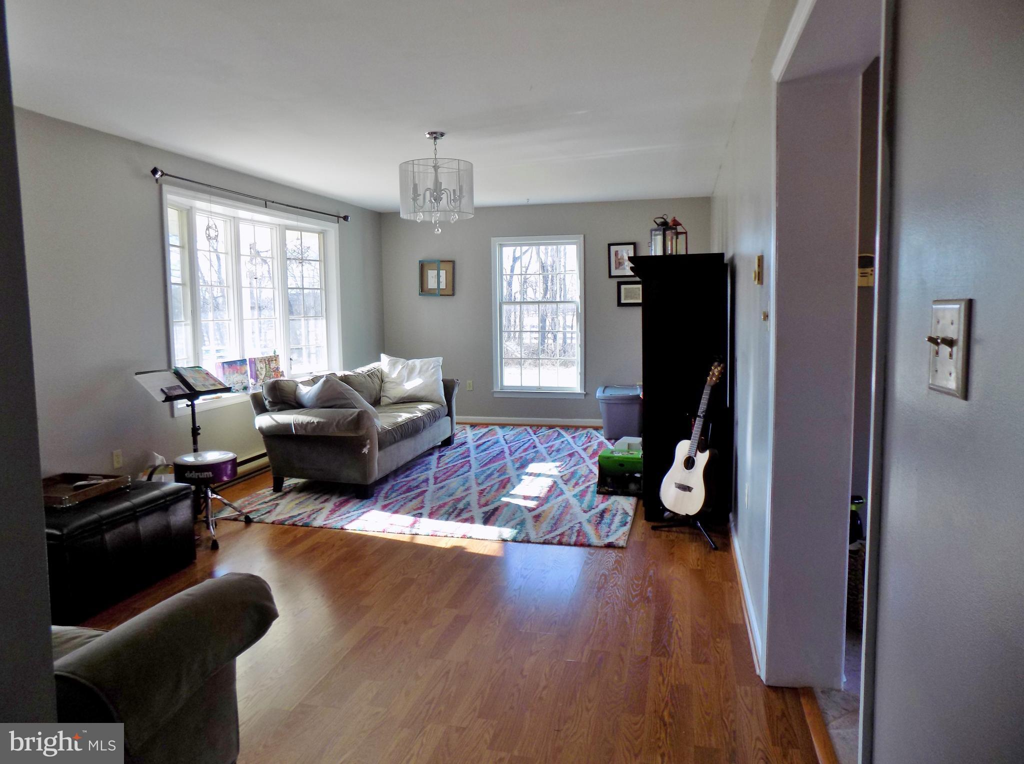 150 Longmarsh Road Berryville, VA 22611 - Photo 14 of 22 a living room with furniture window and wooden floor