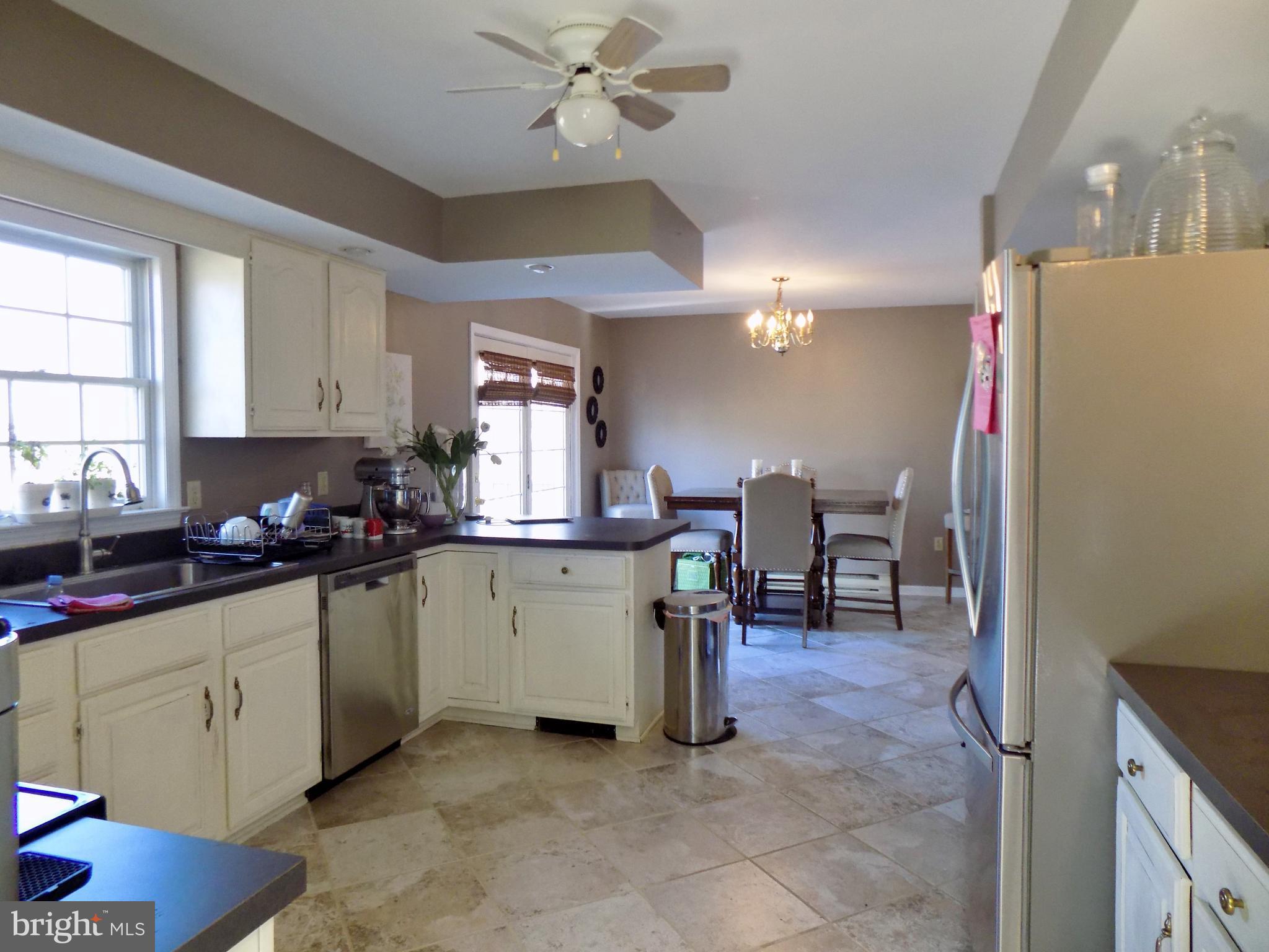 150 Longmarsh Road Berryville, VA 22611 - Photo 15 of 22 a kitchen with a sink cabinets and window