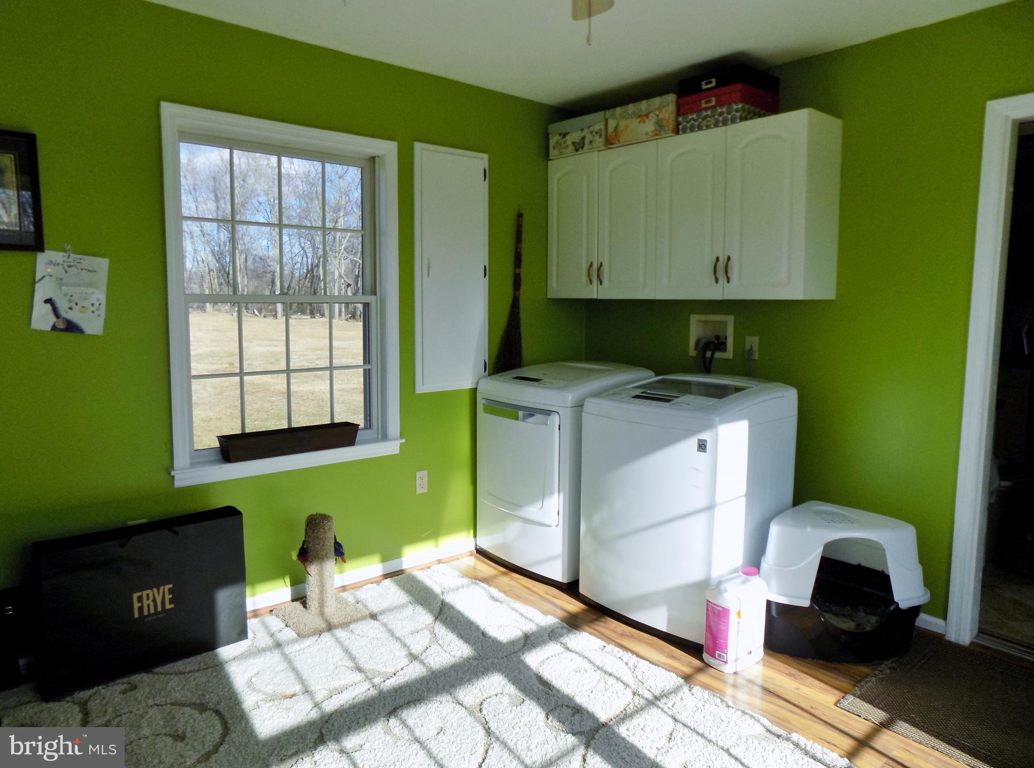 150 Longmarsh Road Berryville, VA 22611 - Photo 17 of 22 a room with washing machine and window