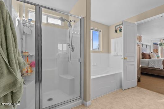 552 Spur Court Fernley, NV 89408 - Photo 29 of 46 a bathroom with a glass shower door and a sink