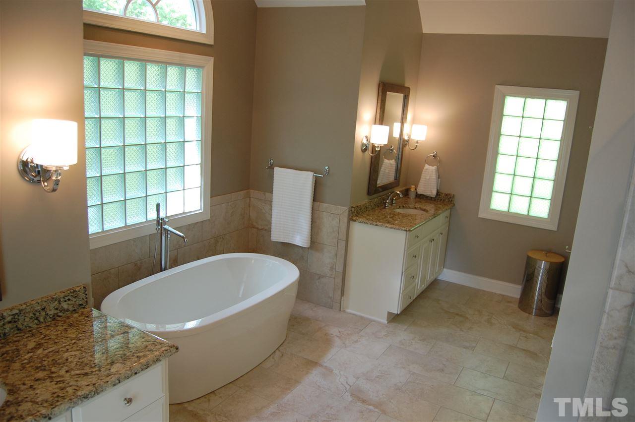 10425 Roadstead Way West Raleigh, NC 27613 - Photo 14 of 25 a bathroom with a granite countertop sink and a mirror