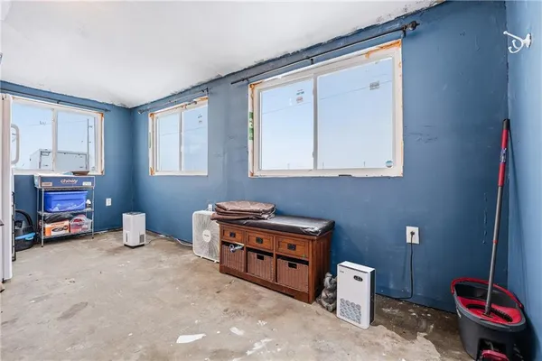 a room with furniture and a chair